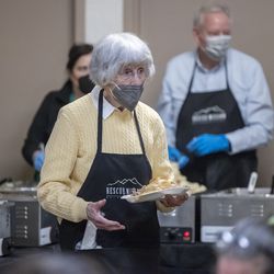 Homeless activist Pamela Atkinson serves Thanksgiving dinner at the Salt Lake City Rescue Mission on Monday, November 22, 2021.