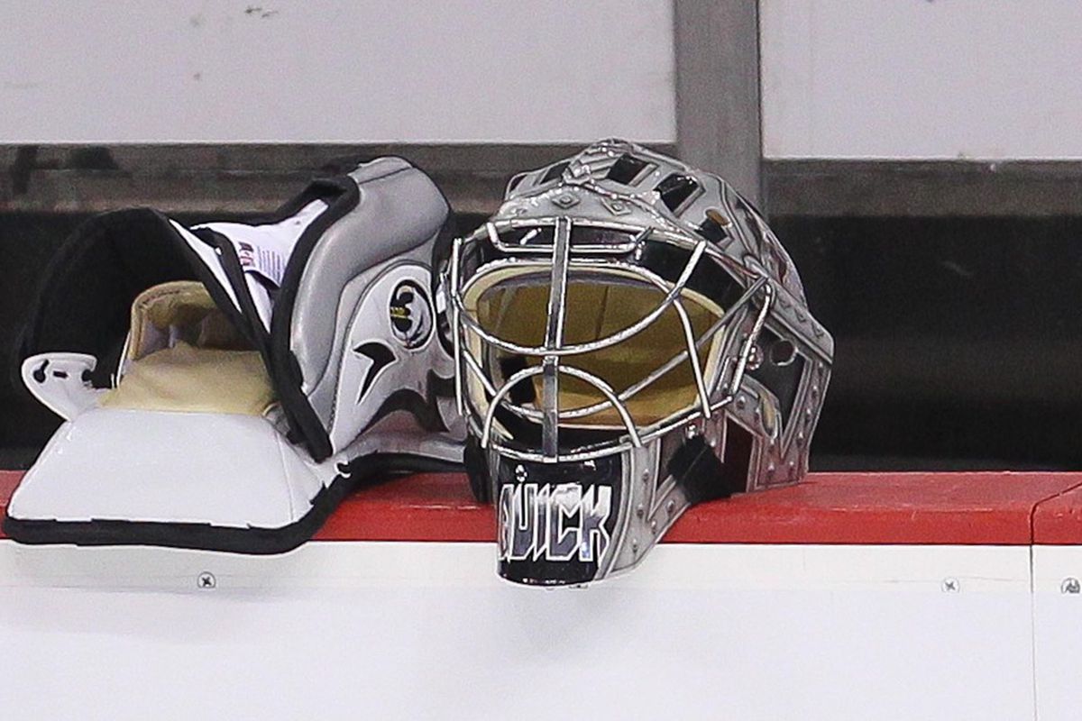 May 29; Newark, NJ, USA; The mask and blocker of Los Angeles Kings goalie Jonathan Quick (32) lies on the bench during practice on media day for the 2012 Stanley Cup Finals at the Prudential Center. Mandatory Credit: Ed Mulholland-US PRESSWIRE