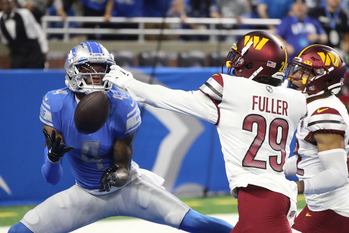 Detroit Lions wide receiver DJ Chark (4) is defended by Washington Commanders cornerback Kendall Fuller (29) during first half action at Ford Field.