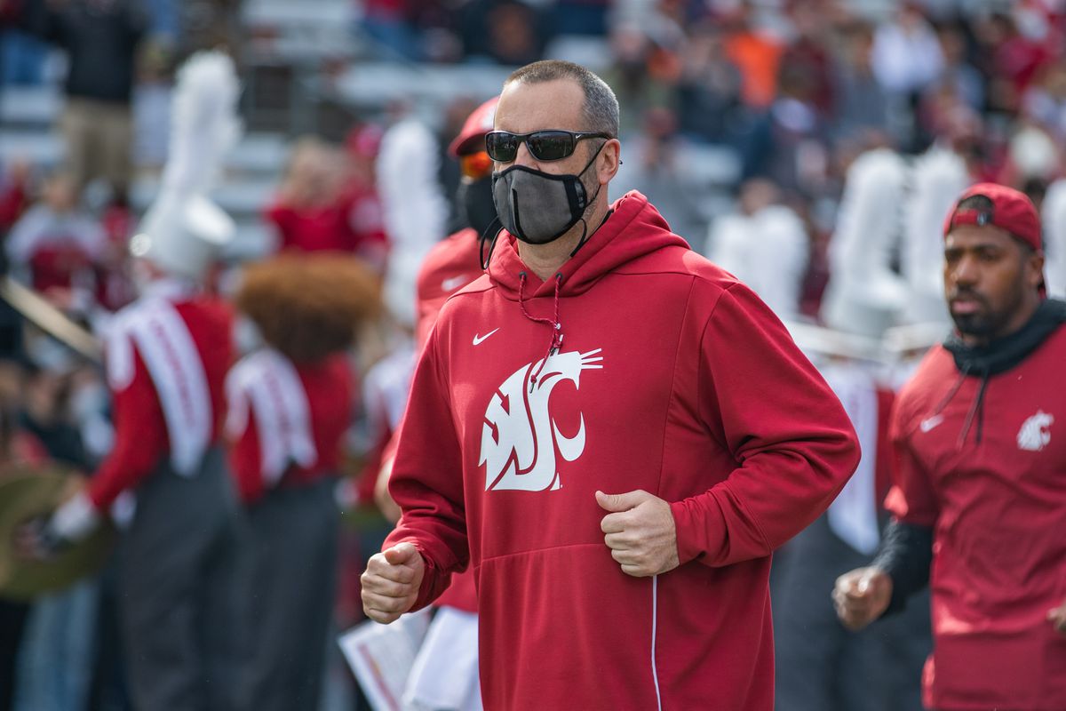 PULLMAN, WA - OCTOBER 9: Washington State head coach Nick Rolovich runs out of the tunnel prior to a PAC 12 conference matchup between the Oregon State Beavers and the Washington State Cougars on October 9, 2021, at Martin Stadium in Pullman, WA.