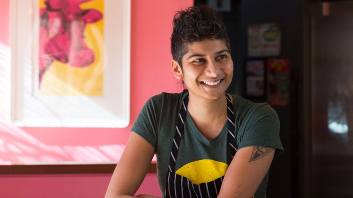 Chef Preeti Mistry leans on a counter.