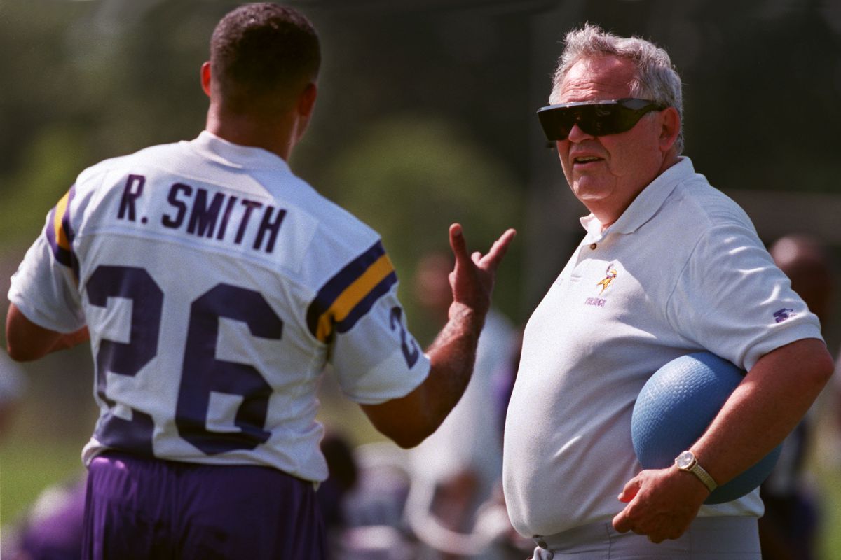 Robert Smith talks with long time trainer Fred Zamberletti during Wednesday morning’s opening session of Vikings Training Camp. Smith spent most of his day with Zamberletti working of his injured leg.(Photo by RITA REED/Star Tribune via Getty Images)