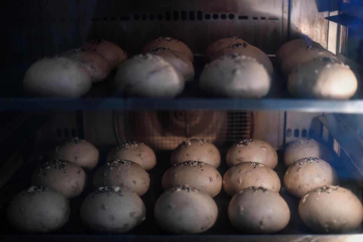 Two shelves of round bread