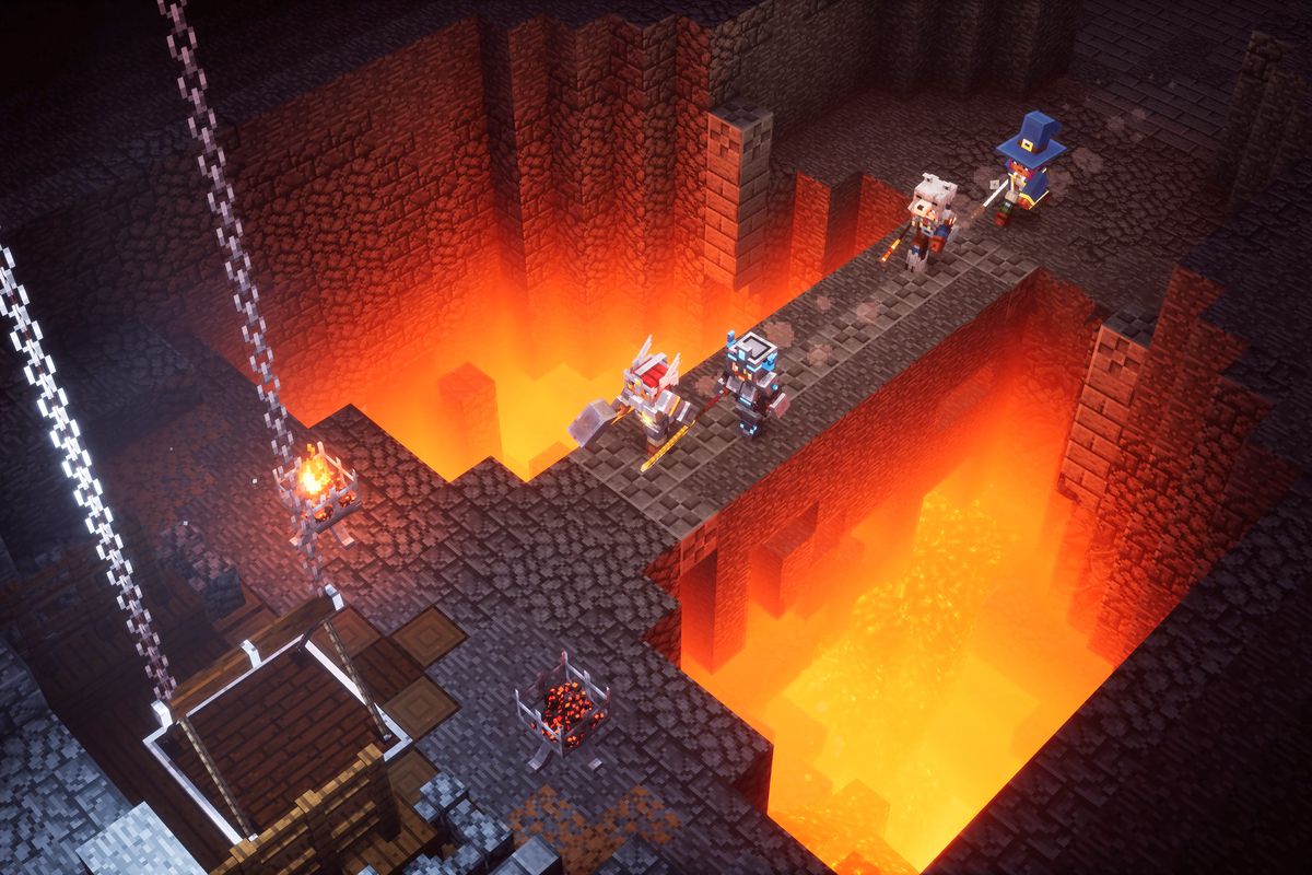 Dungeon crawlers crossing a bridge over lava in Minecraft Dungeons