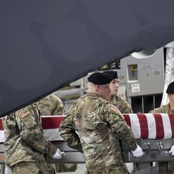 An Army carry team moves a transfer case containing the remains of Staff Sgt. Aaron R. Butler at Dover Air Force Base, Del., on Friday, Aug. 18, 2017. According to the Department of Defense, Butler, of Monticello, Utah, died Aug. 16, in Nangarhar province, Afghanistan, of injuries sustained from an improvised explosive device while conducting combat operations.