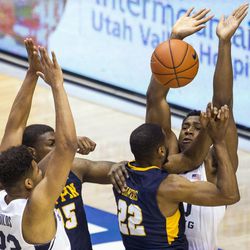 Brigham Young forward Jamal Aytes (40) blocks a shot attempt by Coppin State guard Keith Shivers (22) during an NCAA college basketball game in Provo on Thursday, Nov. 17, 2016.