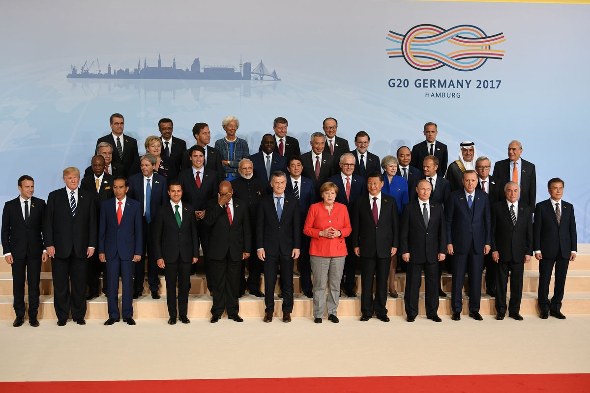 Donald Trump and other dignitaries pose for a photo during the 2017 G20 summit in Hamburg, Germany.