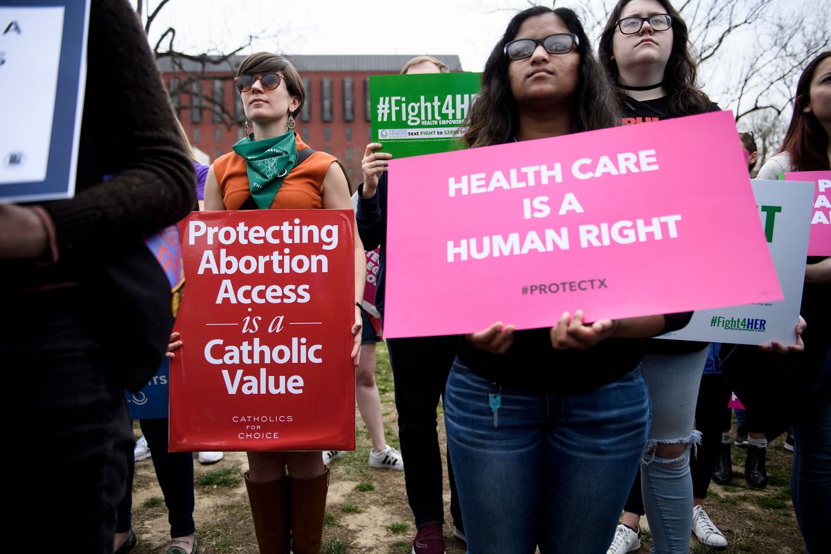 Activists rally in Lafayette Square in Washington in March 2019 to protest the Trump administration’s “global gag rule” that bans funding to non-governmental organizations that provide abortion services or advocacy.