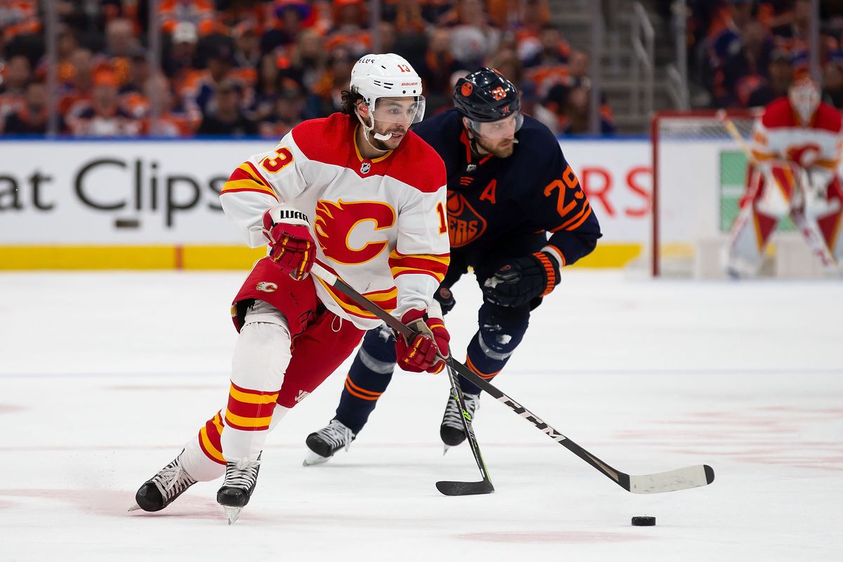 Johnny Gaudreau #13 of the Calgary Flames skates in against Leon Draisaitl #29 of the Edmonton Oilers during the third period in Game Four of the Second Round of the 2022 Stanley Cup Playoffs at Rogers Place on May 24, 2022 in Edmonton, Canada.