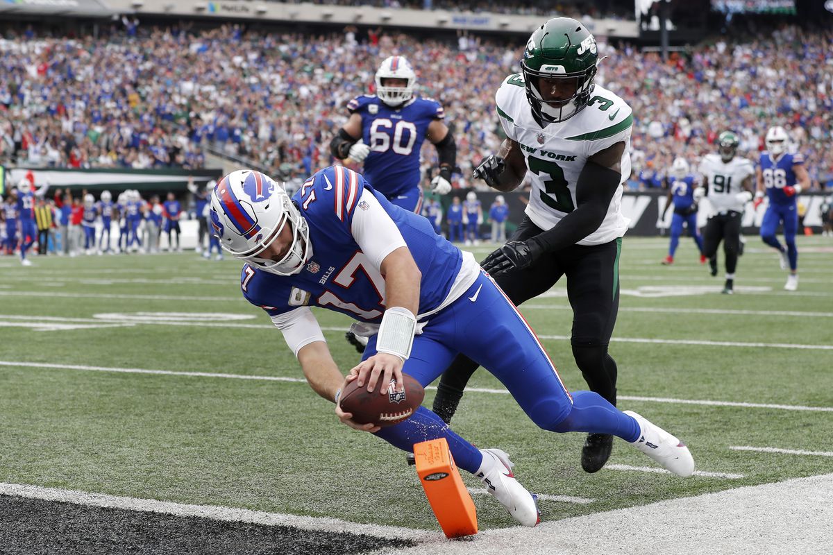 Josh Allen #17 of the Buffalo Bills runs in a touchdown against Jordan Whitehead #3 of the New York Jets at MetLife Stadium on November 06, 2022 in East Rutherford, New Jersey.