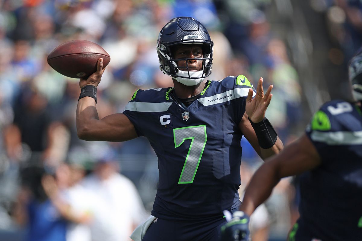 Geno Smith of the Seattle Seahawks attempts a pass against the Los Angeles Rams during the first half at Lumen Field on September 10, 2023 in Seattle, Washington.
