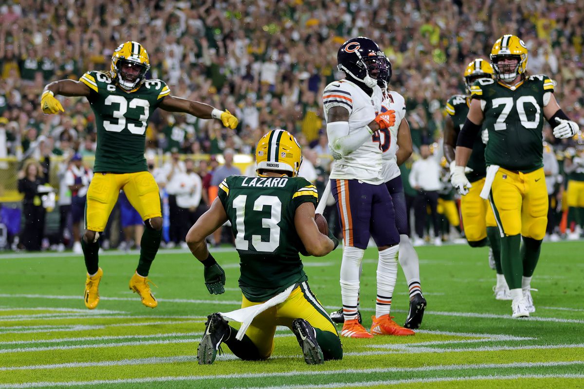 Allen Lazard #13 of the Green Bay Packers celebrates with teammates after a touchdown during the first half in the game against the Chicago Bears at Lambeau Field on September 18, 2022 in Green Bay, Wisconsin.
