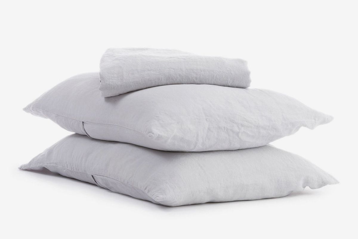 Stack of gray pillows.