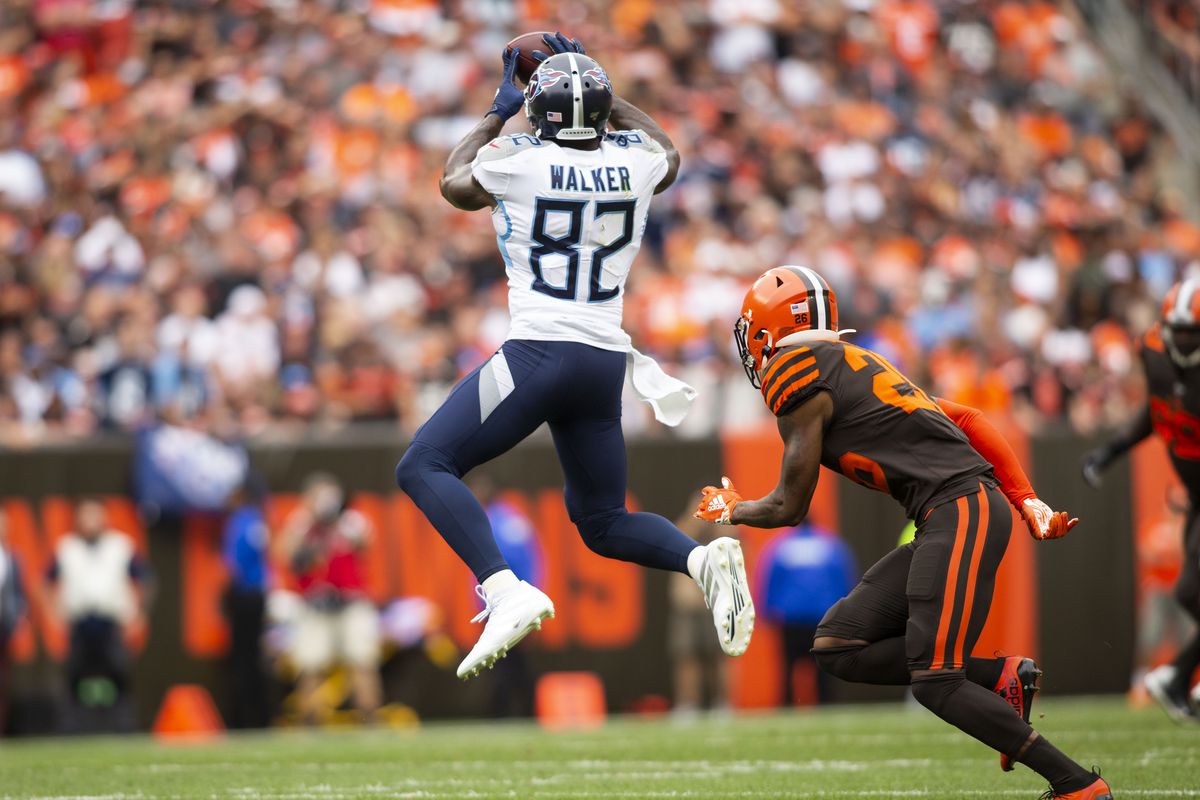 Tennessee Titans tight end Delanie Walker makes a reception for a first down under coverage by Cleveland Browns cornerback Greedy Williams during the second quarter at FirstEnergy Stadium.