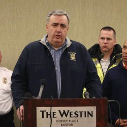 Boston Police Commissioner Edward Davis speaks about the explosions during a press conference as Massachusetts Gov Deval Patrick, right, looks on, Monday, April 15, 2013, in Boston. Two explosions disrupted the Boston Marathon on Monday, causing at least two deaths and dozens of injuries and scattering crowds near the finish line, authorities said. 