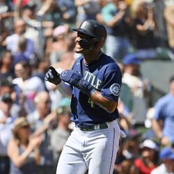 SEATTLE, WASHINGTON - AUGUST 25: Julio Rodriguez #44 of the Seattle Mariners reacts to Mitch Haniger #17 a three-run home run during the first inning against the Cleveland Guardians at T-Mobile Park on August 25, 2022 in Seattle, Washington.