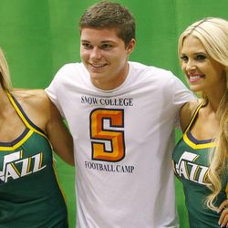 Alex Smith gets a photo taken with Utah Jazz dancers Ashley Kelson and Tasha Smedley as Utah Jazz fans attend the team's 2013 NBA draft party at EnergySolutions Arena on Thursday, June 27, 2013.