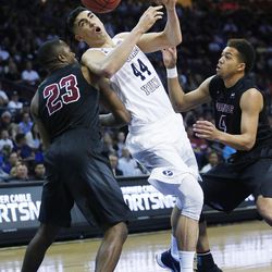 Brigham Young Cougars center Corbin Kaufusi (44) is fouled by Santa Clara Broncos guard Jared Brownridge (23) during the WCC tournament in Las Vegas Saturday, March 5, 2016. 