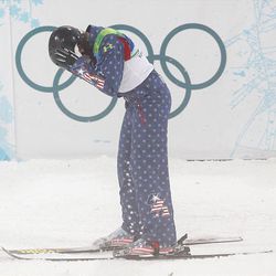 Emily Cook of the United States reacts after crashing on her first jump during the freestyle skiing women's aerials final Wednesday at the 2010 Winter Olympics in Vancouver.