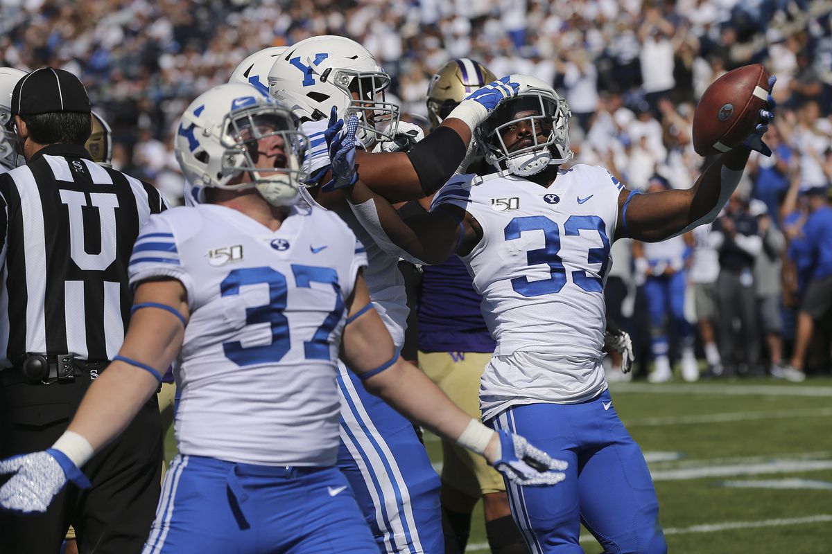 Brigham Young Cougars running back Emmanuel Esukpa (33) celebrates his touchdown with teammates in Provo on Saturday, Sept. 21, 2019.