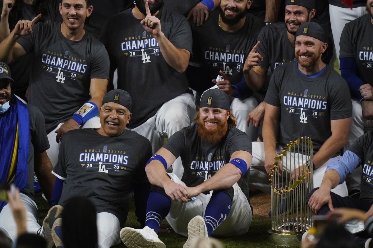 Dodgers third baseman Justin Turner sits next to manager Dave Roberts after the team won the World Series. 
