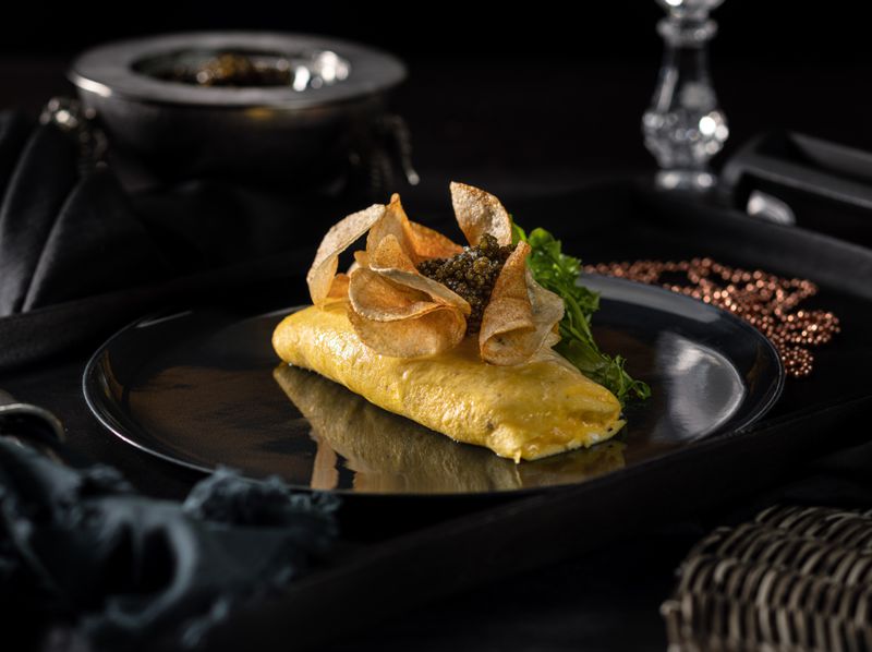 An omelet with potatoes and caviar.