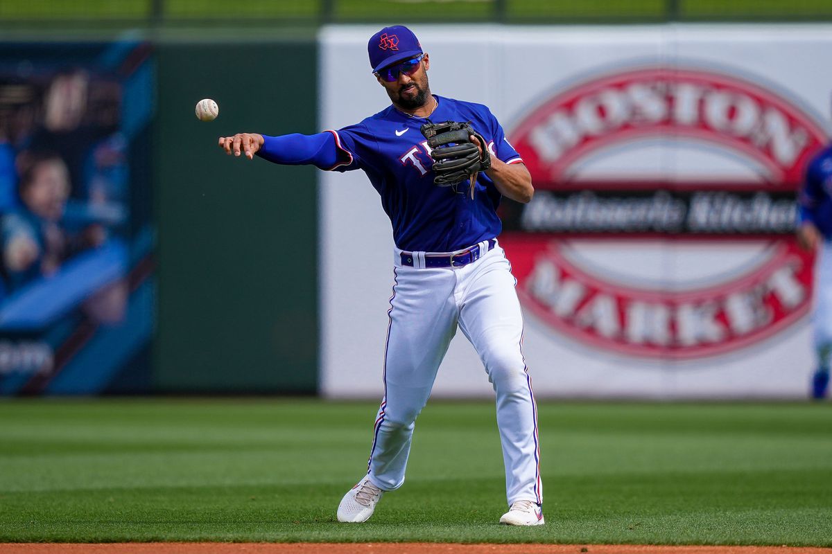 Marcus Semien #2 of the Texas Rangers throws to first base in the first inning against the Chicago Cubs during a Spring Training game at Surprise Stadium on March 07, 2023 in Surprise, Arizona.