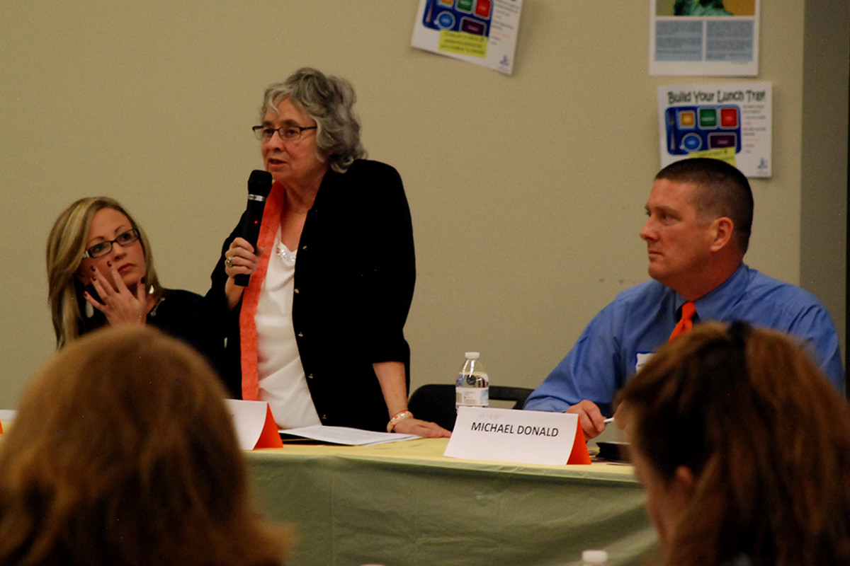 Aurora school board candidates, from left, Monica Colbert, Billie Day, and Mike Donald took questions from parents at a candidate forum Thursday.