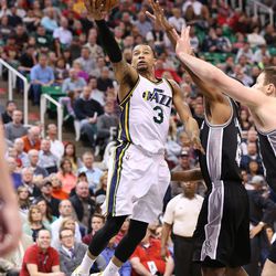Utah Jazz guard Trey Burke (3) puts up a shot as the Utah Jazz defeat the San Antonio Spurs 90-81 in NBA basketball Monday, Feb. 23, 2015, in Salt Lake City.  
