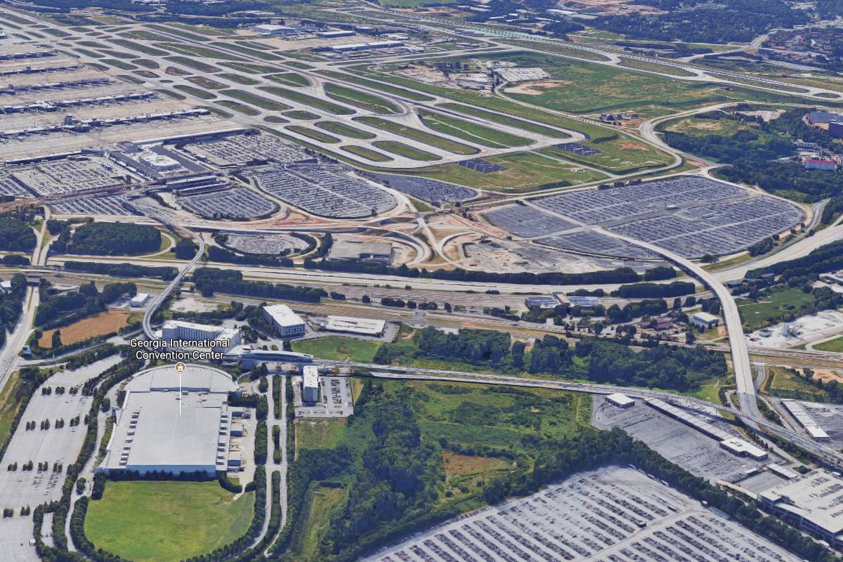 An aerial view of the facility, with the runways in the background.
