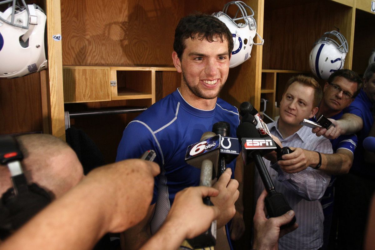 May 4, 2012; Indianapolis, IN, USA; Indianapolis Colts quarterback Andrew Luck (12) does media interviews in front of his locker after practice during minicamp at the Indiana Farm Bureau Football Center. Mandatory Credit: Brian Spurlock-US PRESSWIRE