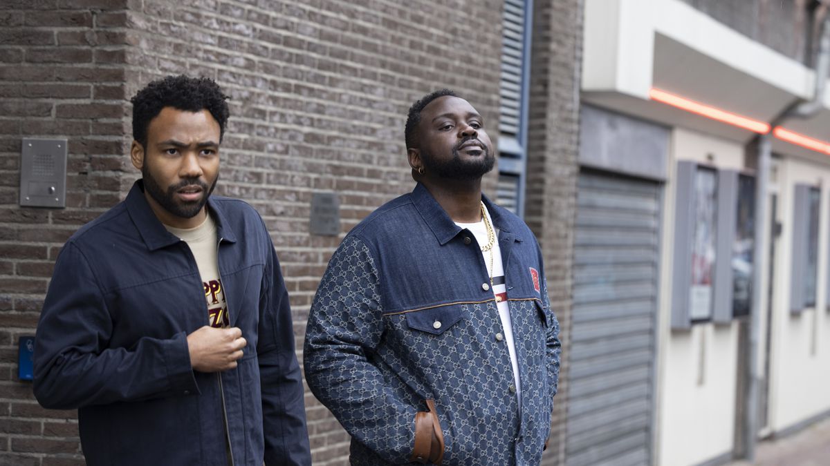 Earn Marks and his rapper cousin Paper Boi in the streets of Amsterdam in season 3 of FX’s Atlanta.