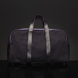 <strong>Haerfest</strong> Overnight Duffel in Black on Black, <a href="http://unisnewyork.com/pages/about-us">$439</a> at Unis