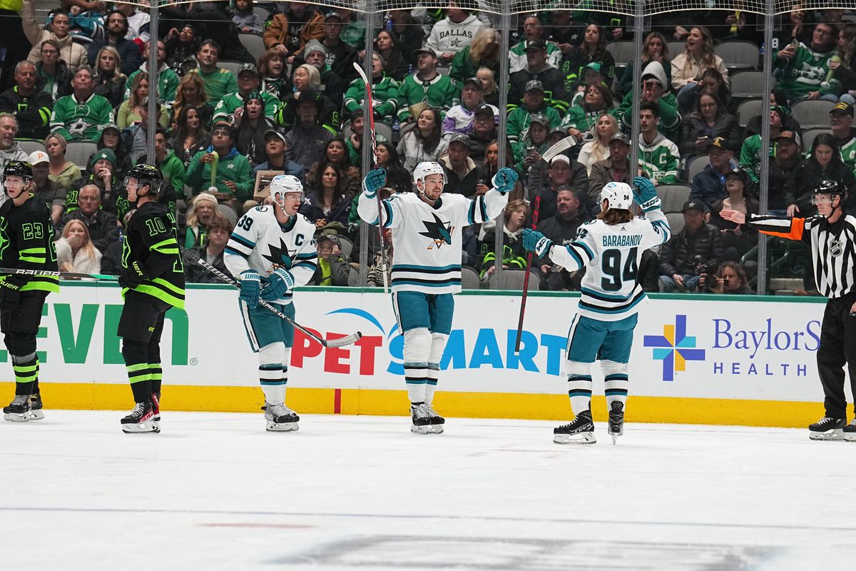 Logan Couture #39, Tomas Hertl #48 and Alexander Barabanov #94 of the San Jose Sharks celebrate against the Dallas Stars at the American Airlines Center on November 11, 2022 in Dallas, Texas.