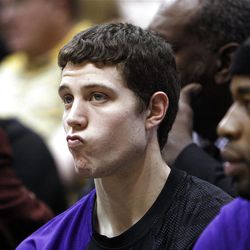 Jimmer Fredette, of Sacramento, sits on the bench during the first half as the Sacramento Kings face the Utah Jazz in NBA basketball in Salt Lake City, Friday, March 30, 2012.