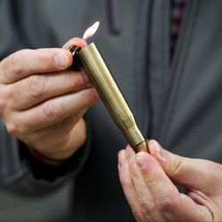 David Johnston, TSA’s social media director, displays a lighter mounted inside of a bullet casing which was confiscated from a passenger at a Transportation Security Administration (TSA) checkpoint at Dulles International Airport in Dulles, Va., Tuesday, March 26, 2019. TSA’s social media presence has been something of a model for other federal agencies _ striking a tone is humorous, but still gives travelers informational dos and don’ts. | AP Photo