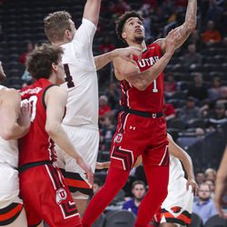 Utah Utes forward Timmy Allen (1) shoots over the Oregon State defense during the first round of the Pac-12 men’s basketball tournament at T-Mobile Arena in Las Vegas on Wednesday, March 11, 2020.