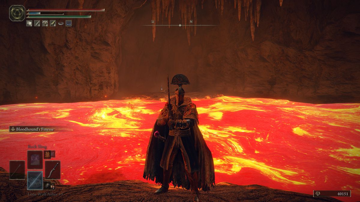 Standing in front of lava near the Magma Wyrm miniboss in Elden Ring’s Volcano Manor Prison Town