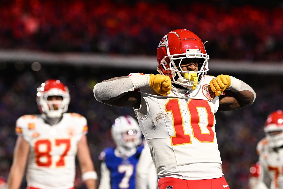 Isiah Pacheco #10 of the Kansas City Chiefs celebrates after scoring a touchdown during the second half of the AFC Divisional Playoff game against the Buffalo Bills at Highmark Stadium on January 21, 2024 in Orchard Park, New York.