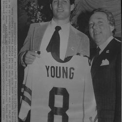 Steve Young the passing great from Brigham Young University, stands with Los Angeles Express owner J. William Oldenburg after it was announced that he had signed what is reported to be the richest sports contract ever with the United States Football League.