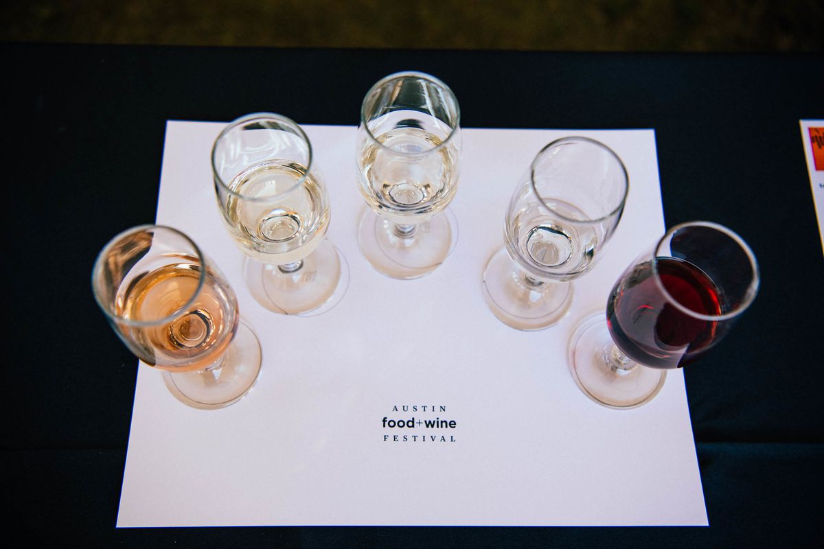 A white paper with five wine glasses in varying shades.