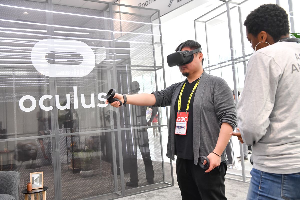 A GDC attendee uses an Oculus VR headset at the Game Developers Conference 2019