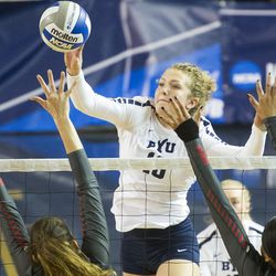 BYU middle hitter Whitney Young Howard spikes the ball during an NCAA volleyball playoff game against UNLV  in Provo on Saturday, Dec. 3, 2016. BYU swept UNLV 3-0 to advance to the Sweet 16.
