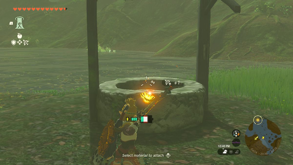 Link shooting a bomb arrow into a well