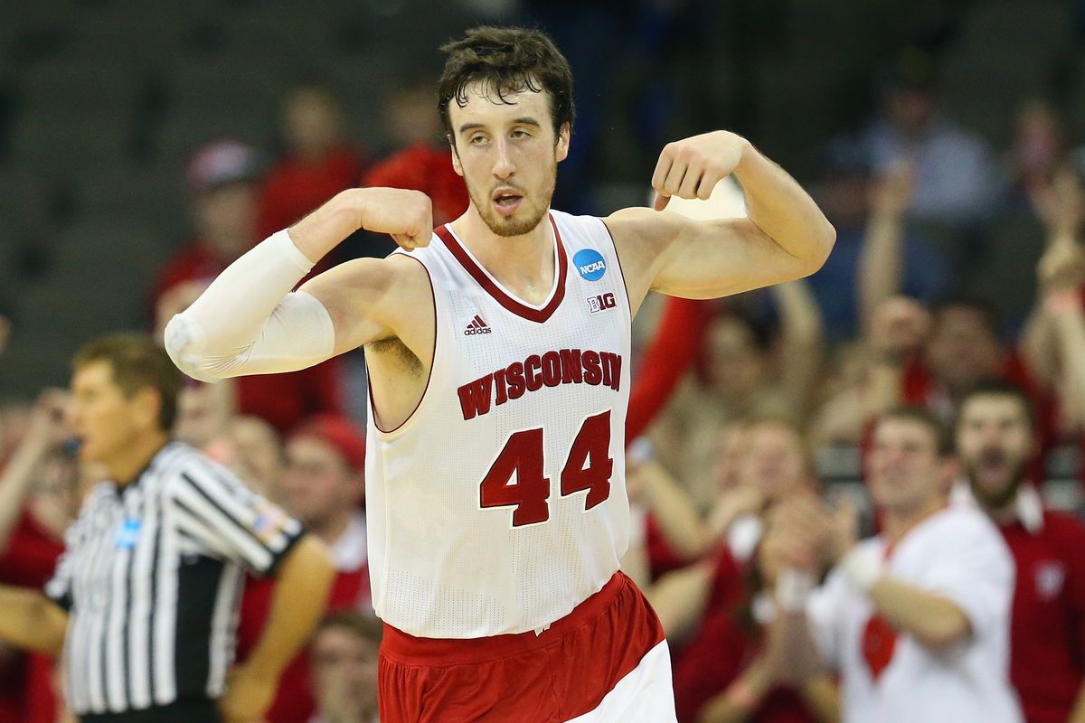 Wisconsin's Frank Kaminsky flexed his muscles after making a late basket to extend the lead over Oregon.