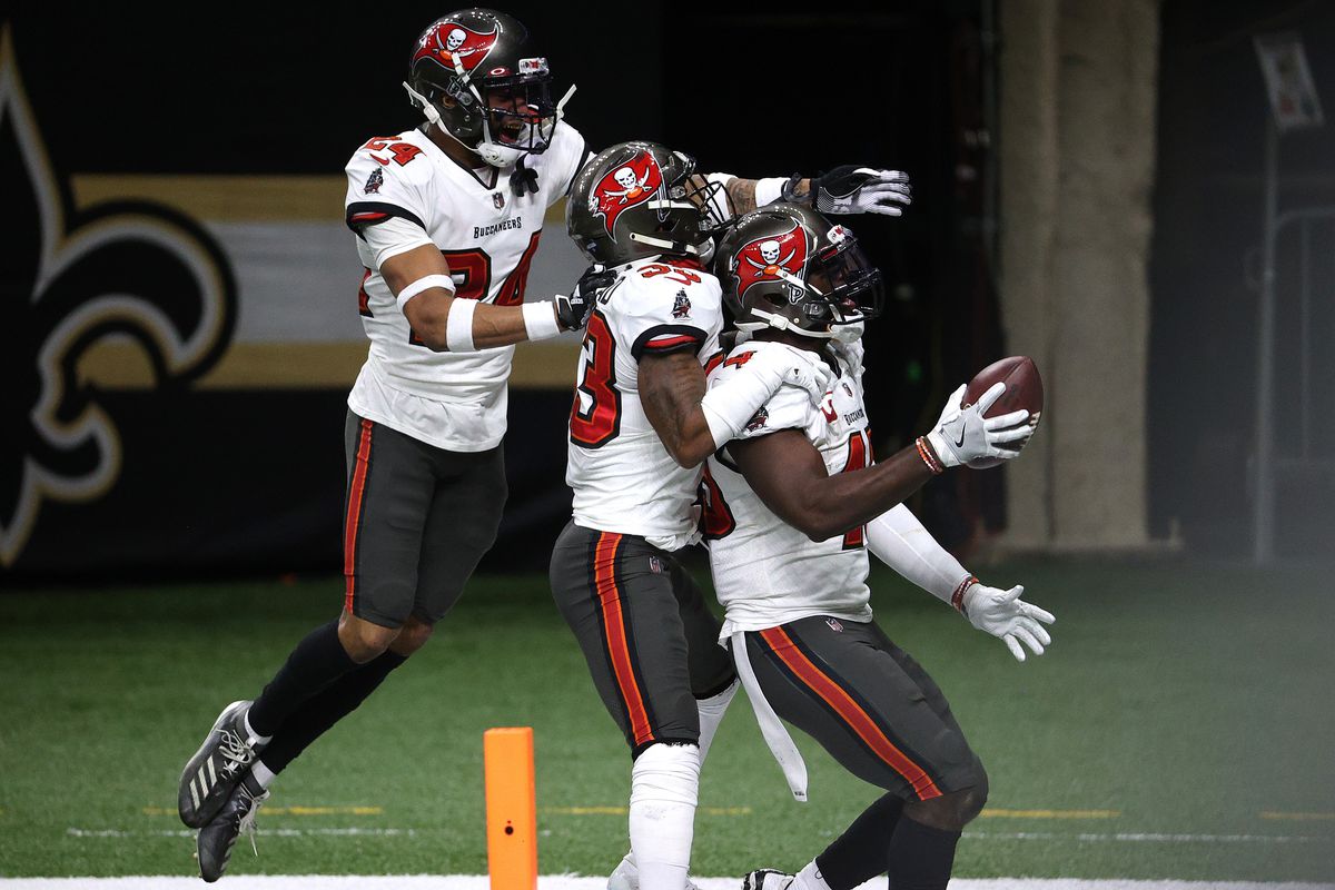 Devin White #45 of the Tampa Bay Buccaneers celebrates with his teammates after intercepting a pass thrown by Drew Brees #9 of the New Orleans Saints during the fourth quarter in the NFC Divisional Playoff game at Mercedes Benz Superdome on January 17, 2021 in New Orleans, Louisiana.