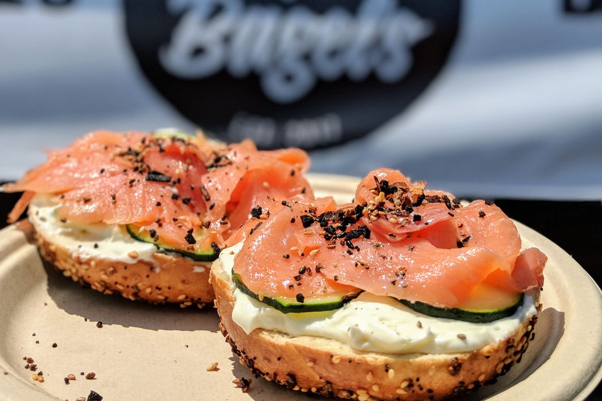 Pop’s Bagels at Smorgasburg on a white plate in the sunshine.