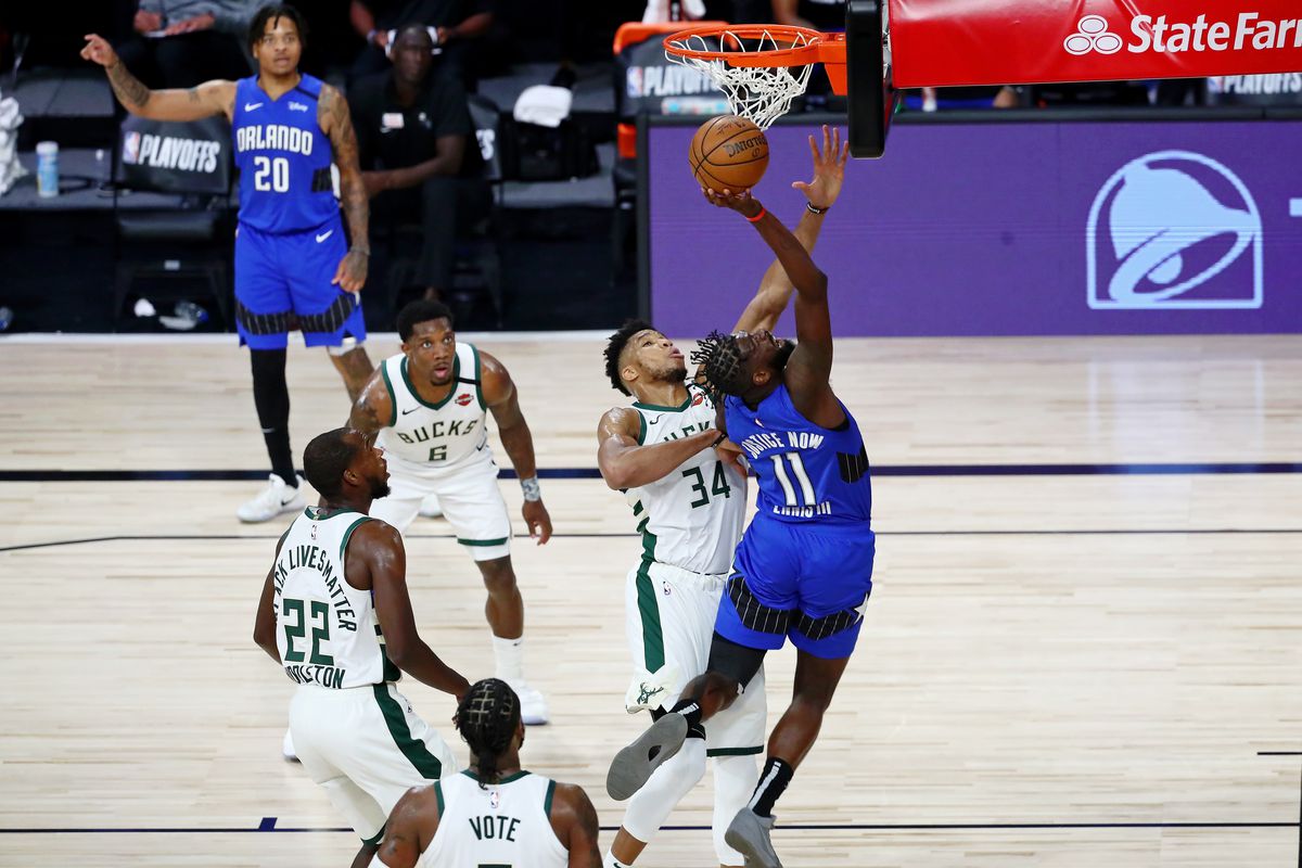James Ennis III of the Orlando Magic shoots against Giannis Antetokounmpo of the Milwaukee Bucks in the second half during Game One in the first round of the NBA playoffs at The Field House at ESPN Wide World Of Sports Complex on August 18, 2020 in Lake Buena Vista, Florida.&nbsp;