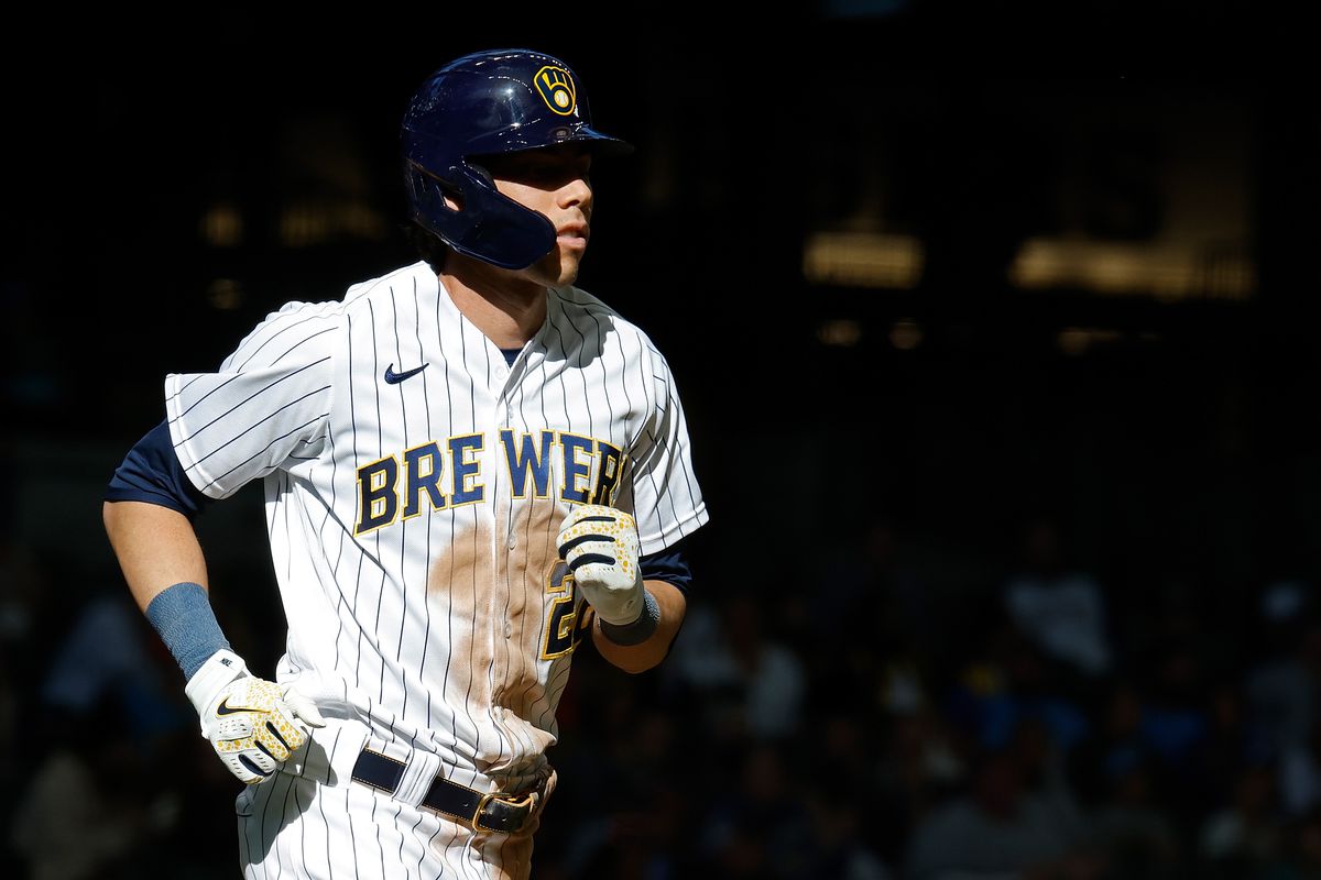Christian Yelich of the Milwaukee Brewers reaches first base on a walk during the game against the Miami Marlins at American Family Field on October 02, 2022 in Milwaukee, Wisconsin.