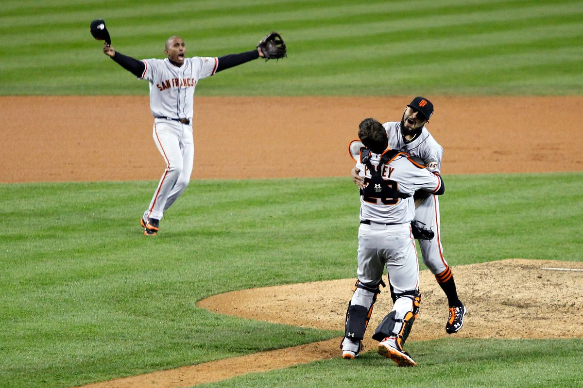 Buster Posey hugging Sergio Romo at the 2012 World Series.